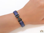 Premium collection band style bracelet in matt blue with black metallic details and black T alphabet motif