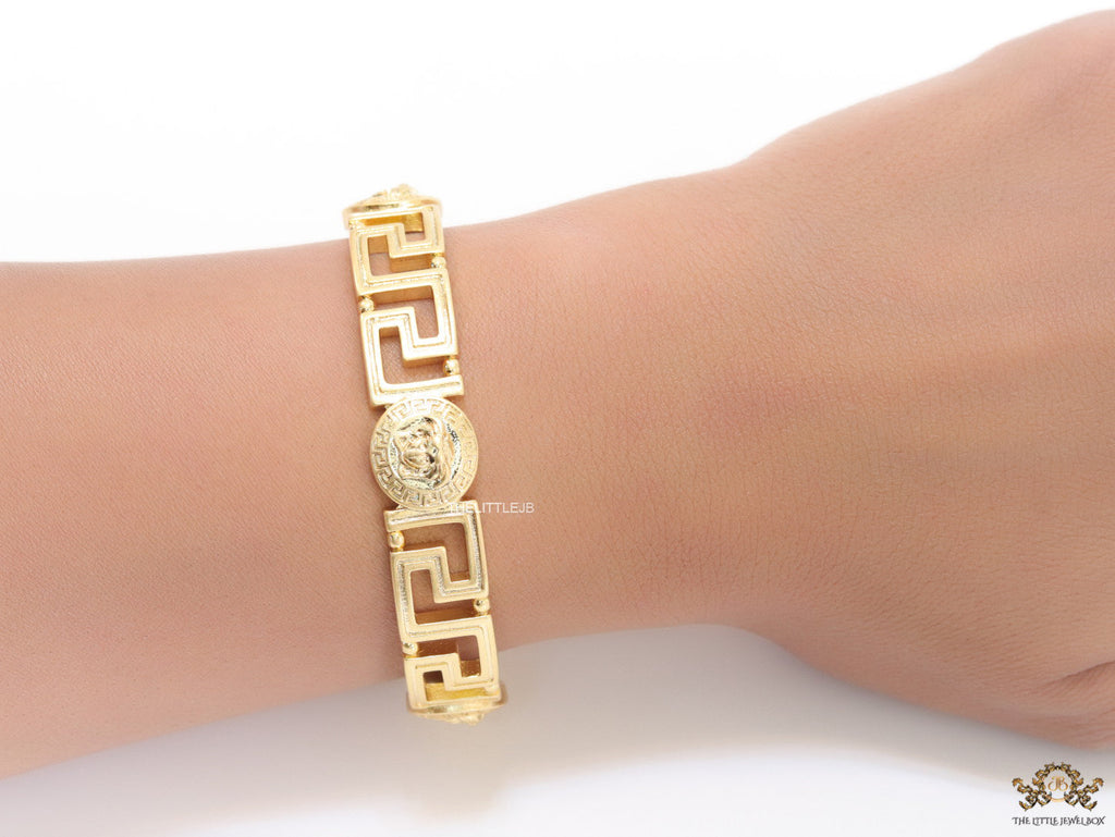 Gold plated designer bracelet with gold plated Medusa face motif