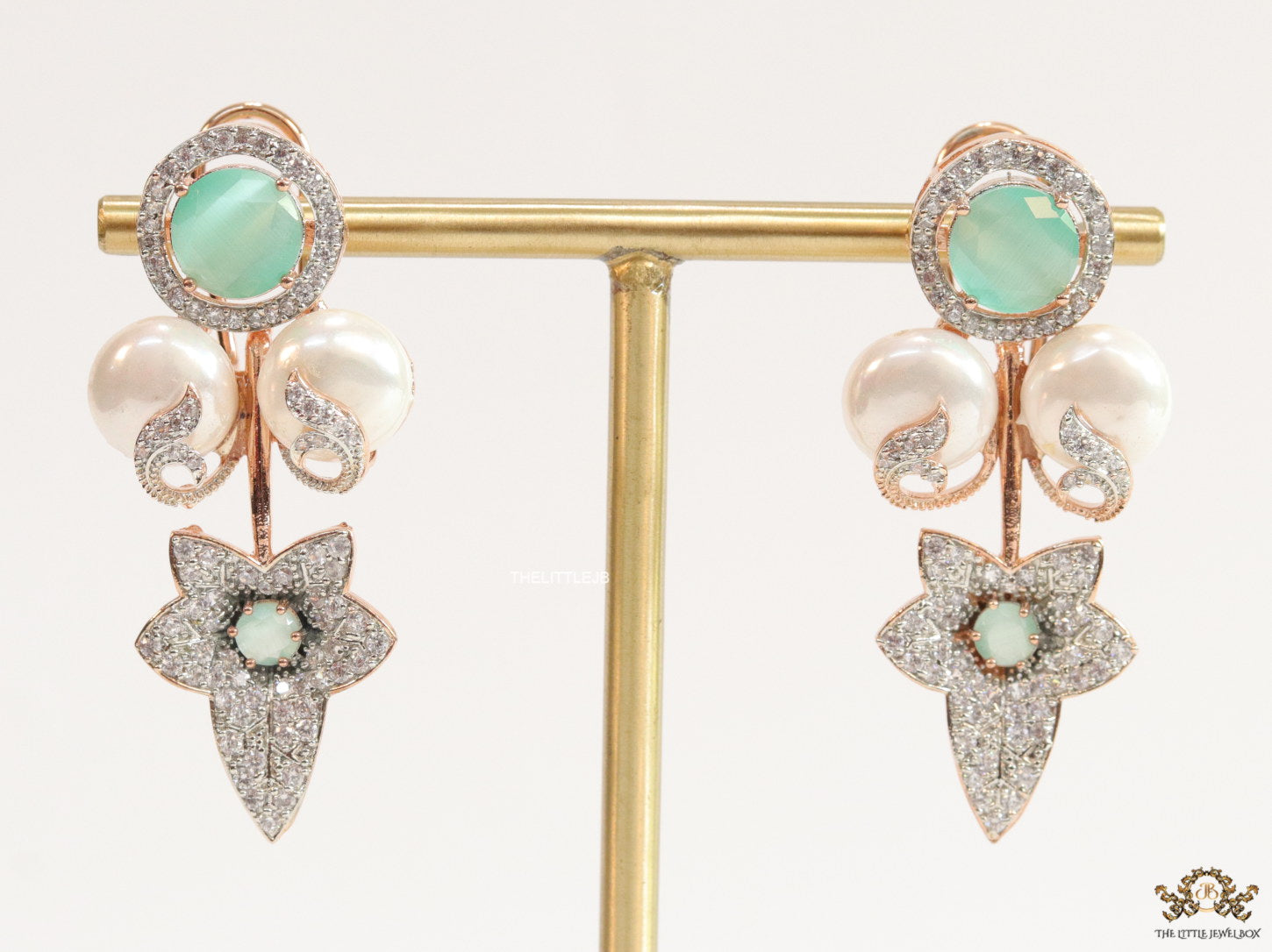 Cz flower earrings with shell pearls and light green stones