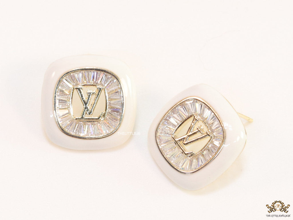 Golden and white square studs with alphabets and cz baguettes