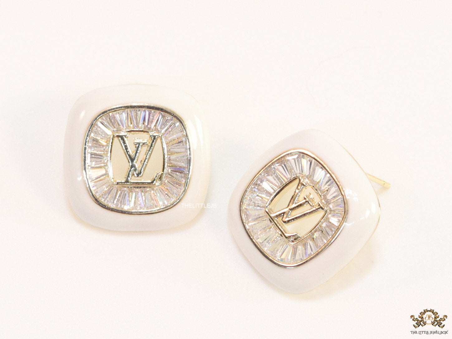 Golden and white square studs with alphabets and cz baguettes