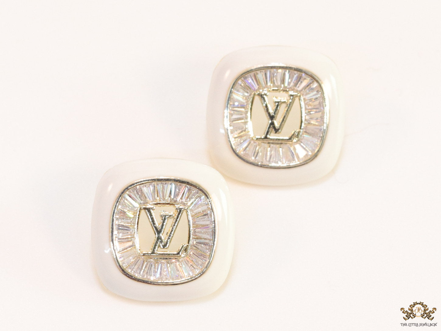 Golden and white square studs with alphabets and cz baguettes