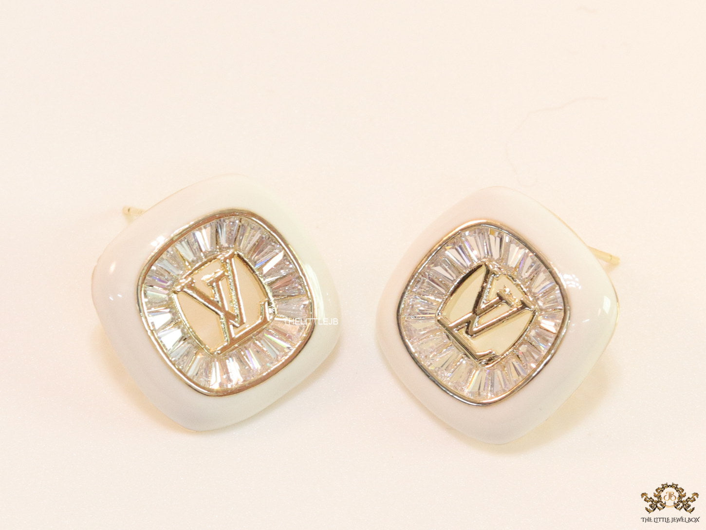 Golden and white square studs with alphabets and cz baguettes