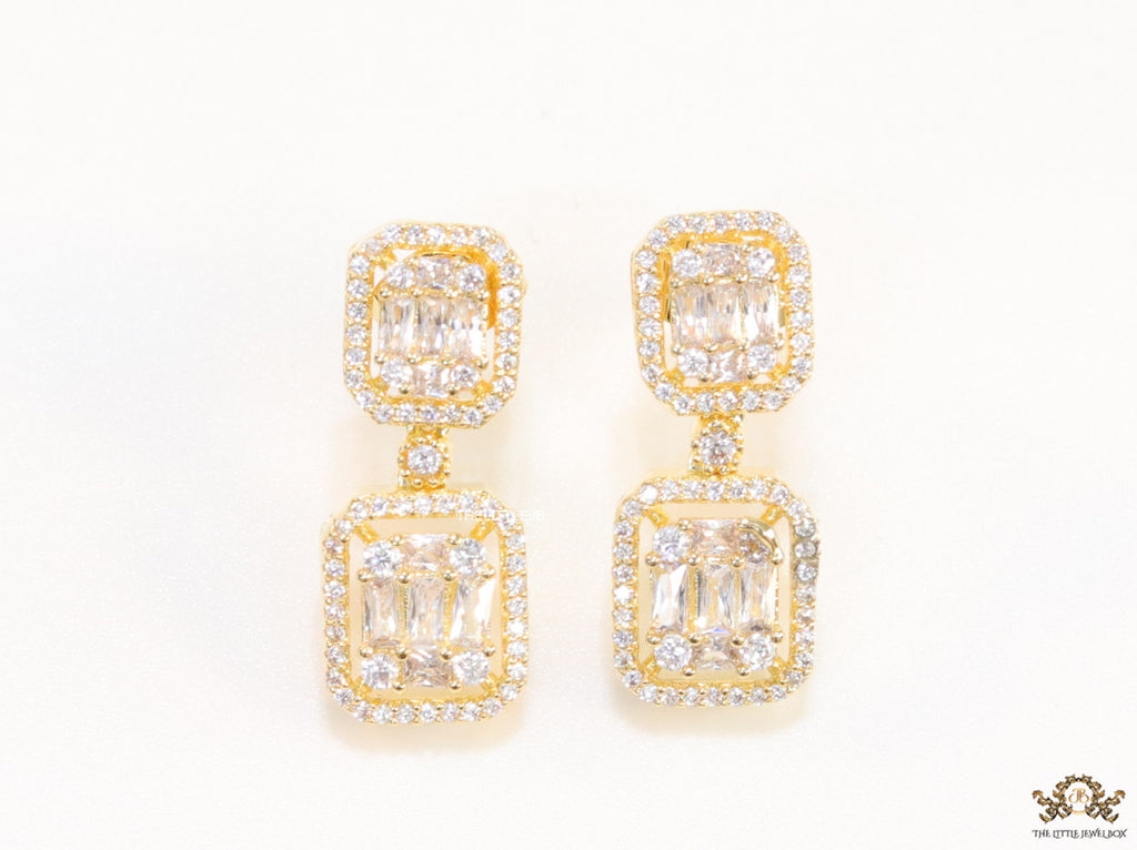 Gold plated cz dangle earrings with cz baguettes