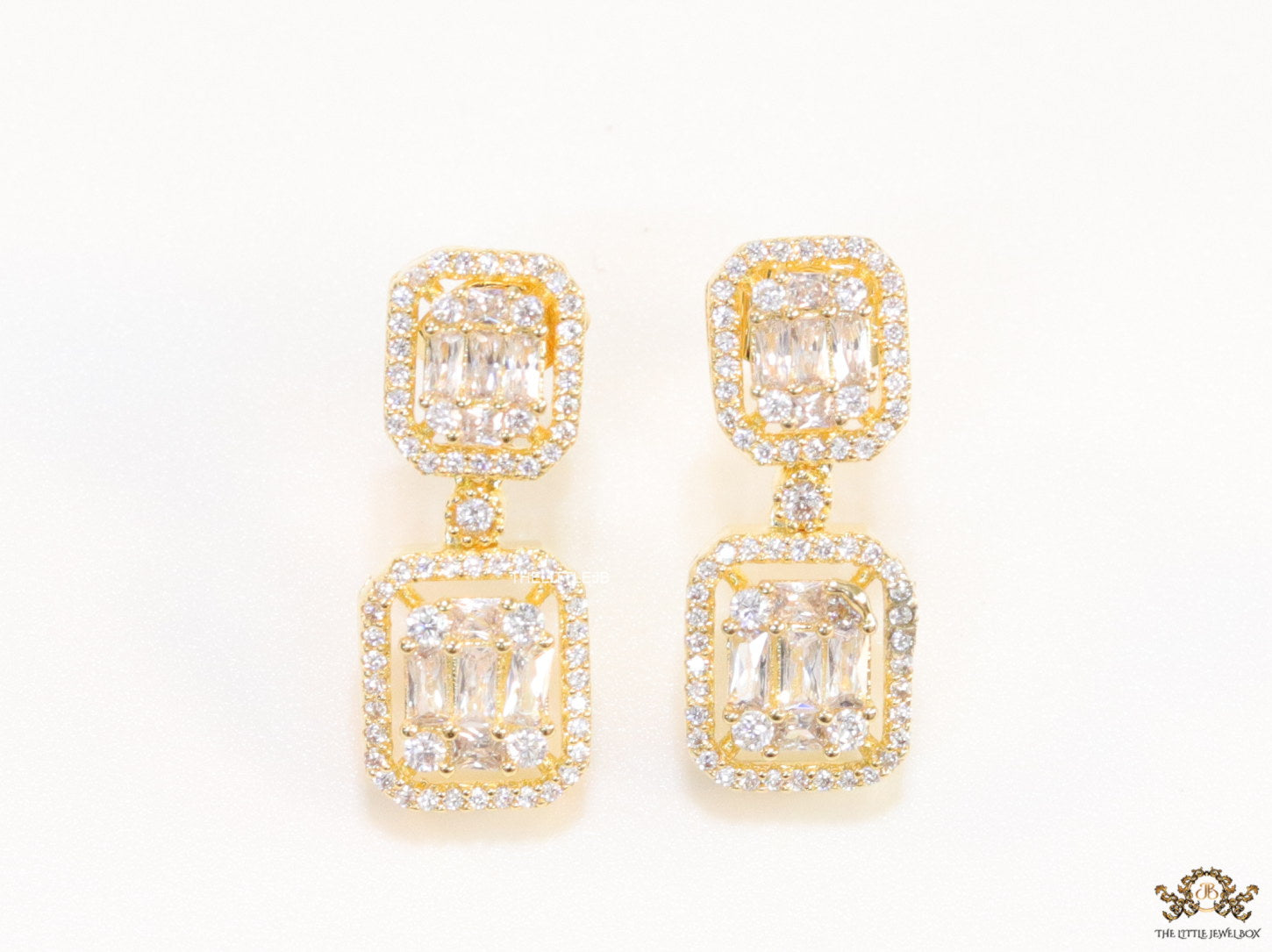Gold plated cz dangle earrings with cz baguettes