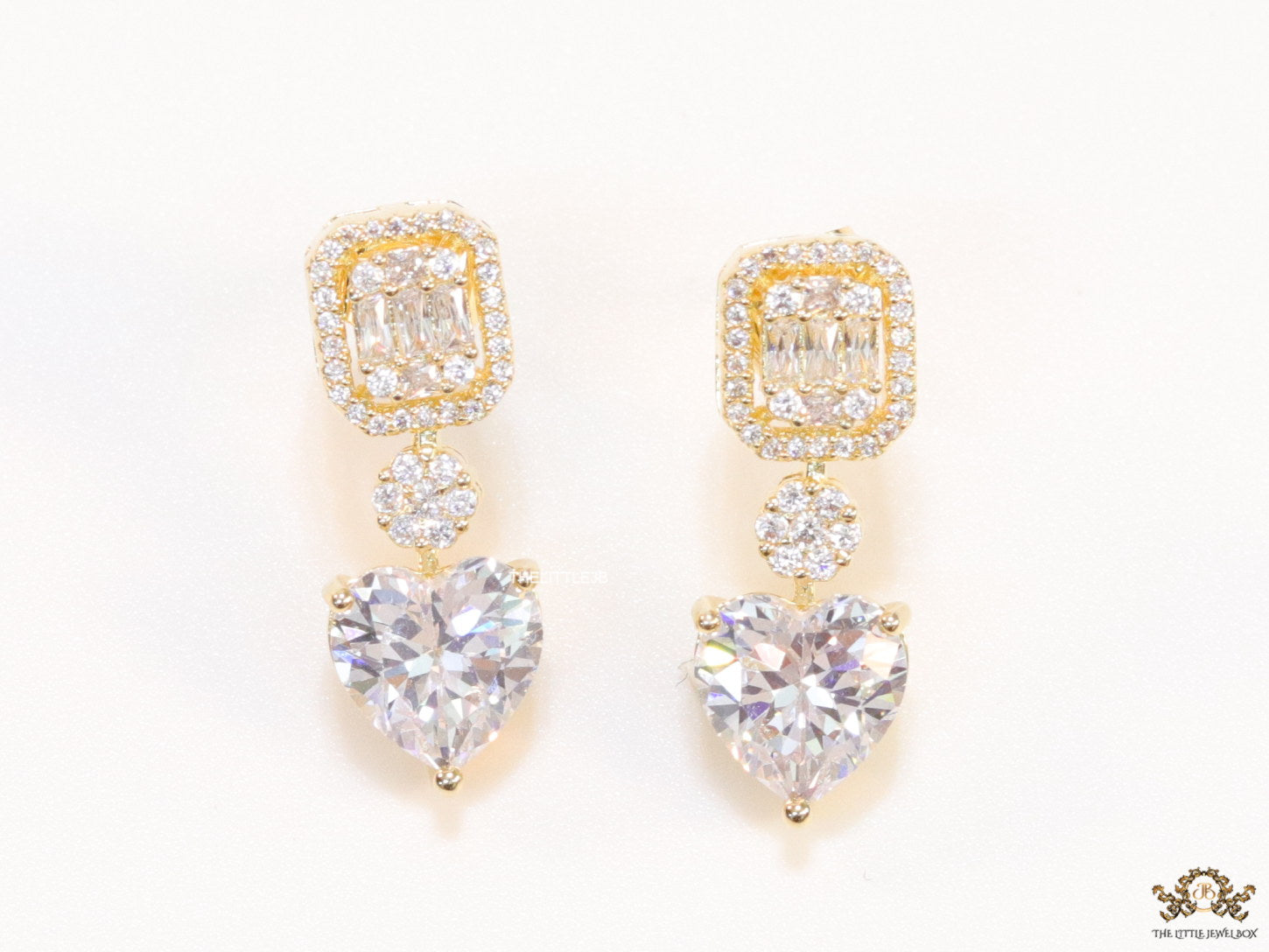 Golden cz baguette earrings with heart shape cz drop