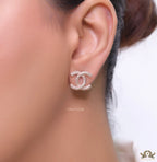 Rose gold plated twin C motif studs with cz