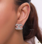 Platinum plated twin C motif studs with fancy cut cz