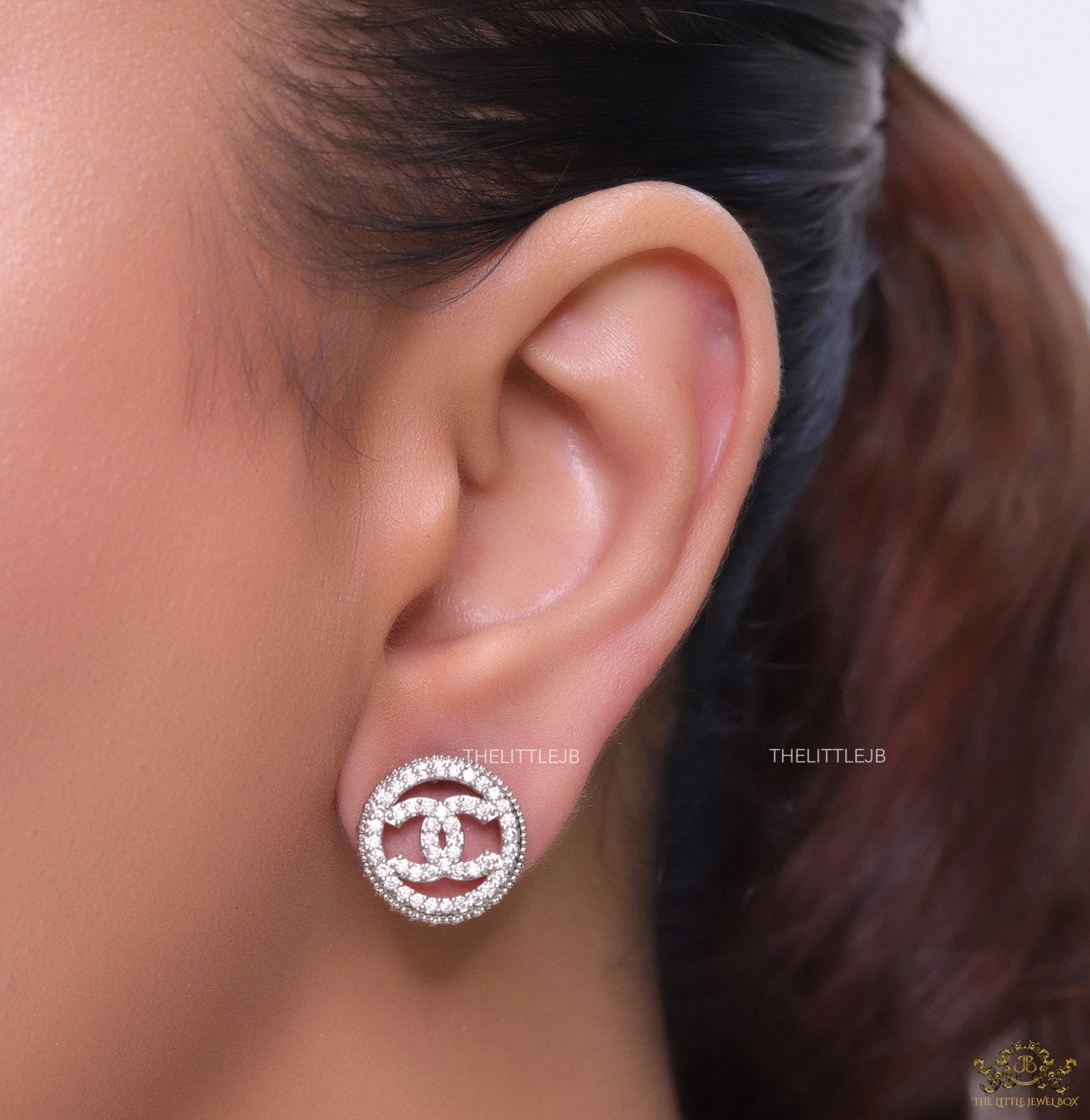 Round platinum studs lined with cz and twin C motif centre