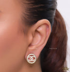 Round golden studs lined with cz and twin C motif centre