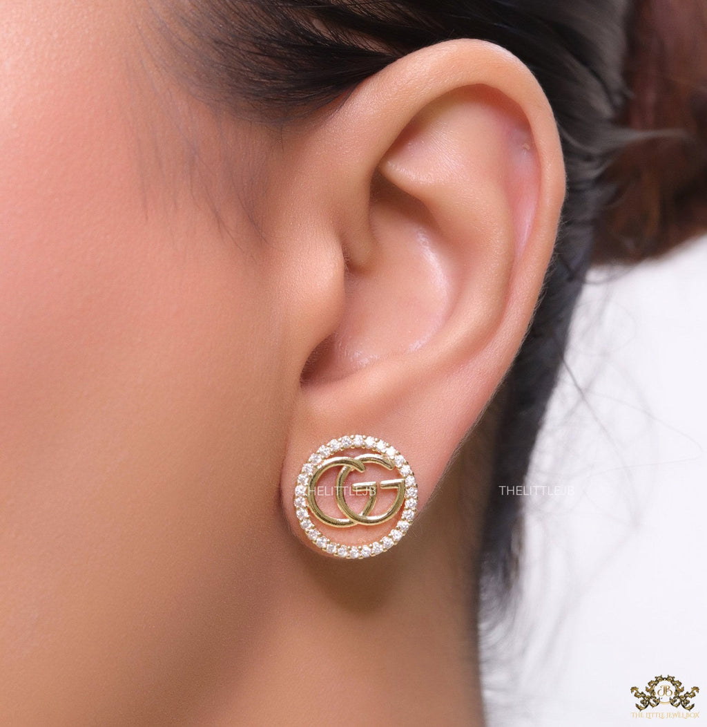 Gold plated round cz earrings with twin G motif