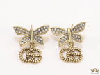 Studed cubic zirconia stone butterfly studs with textured double G motif drop
