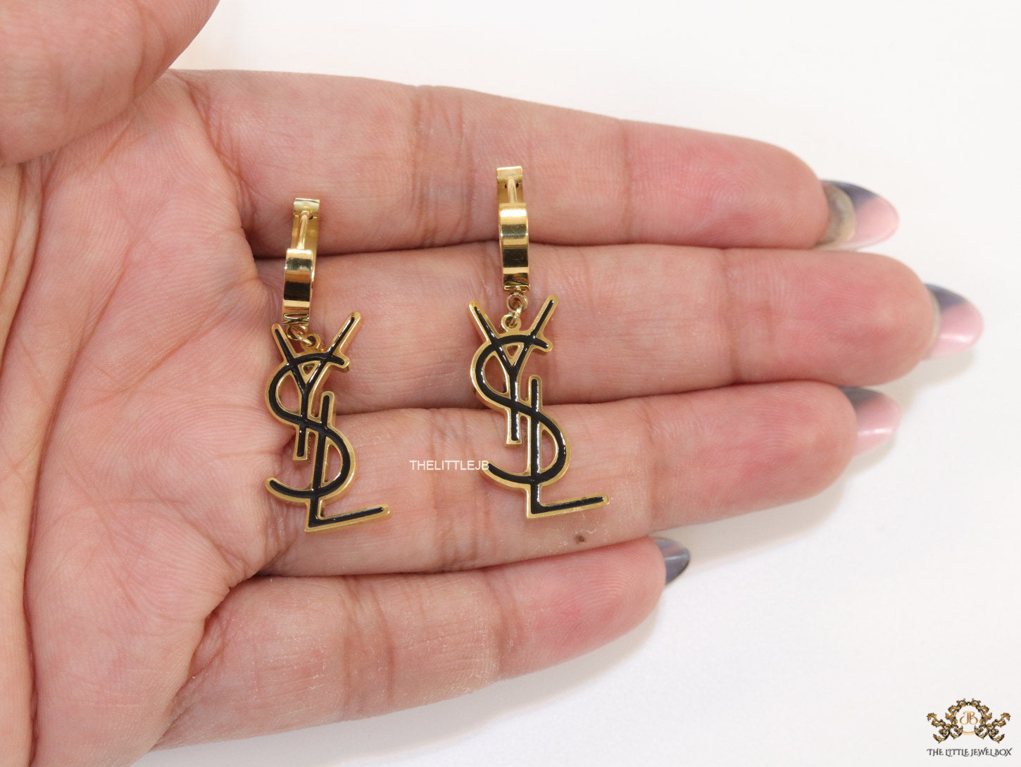 Tiny alphabet earrings in golden and black finish