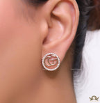 Rose gold plated round cz earrings with twin G motif