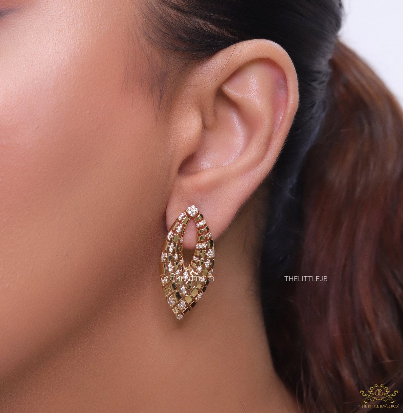 Designer golden earrings with cz