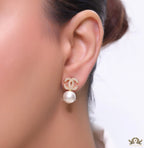 Twin C motif stud in gold and cz with pearl drop