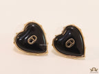 Heart shape black stud earrings with golden alphabets
