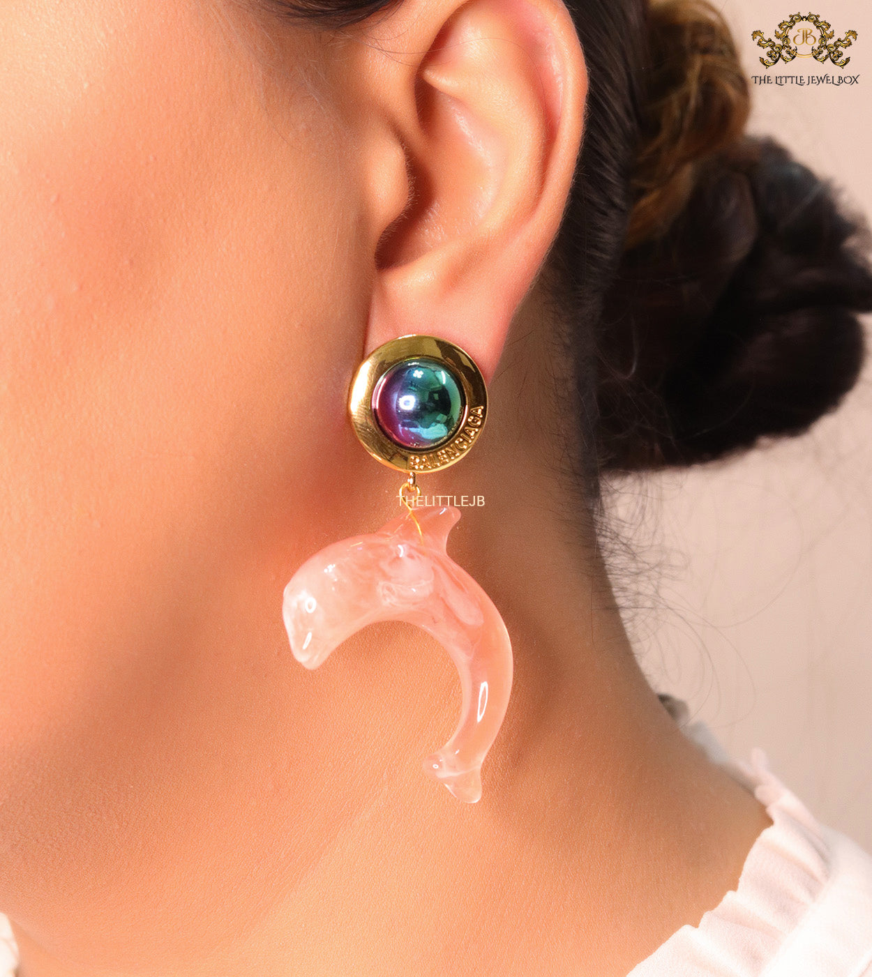 Pink dolphin earring with metallic shade stone
