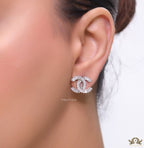 Platinum plated twin C motif studs in cz baguettes