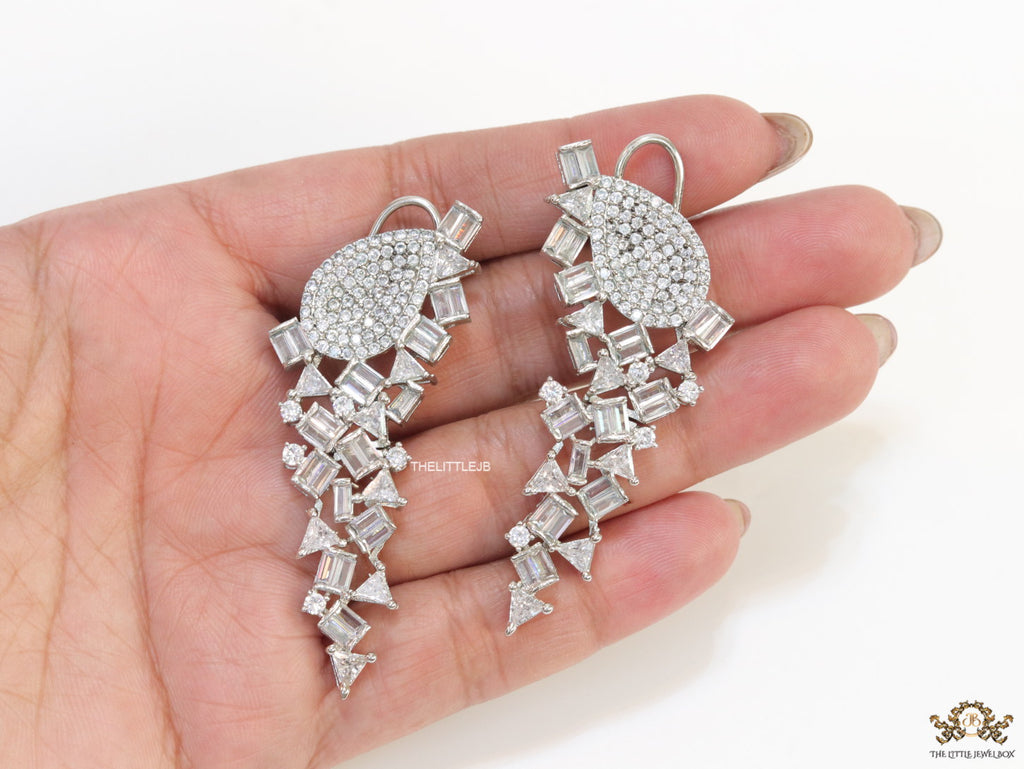 Cz and baguette dangles in platinum finish