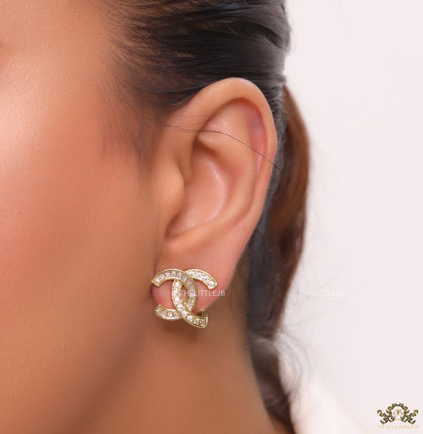 Gold plated twin C motif studs in cz and baguettes