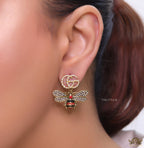 Gold plated twin G cz earrings with honey bee motif drop