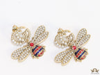 Pearl twin G earrings with pearl and multi cz bees in golden finish