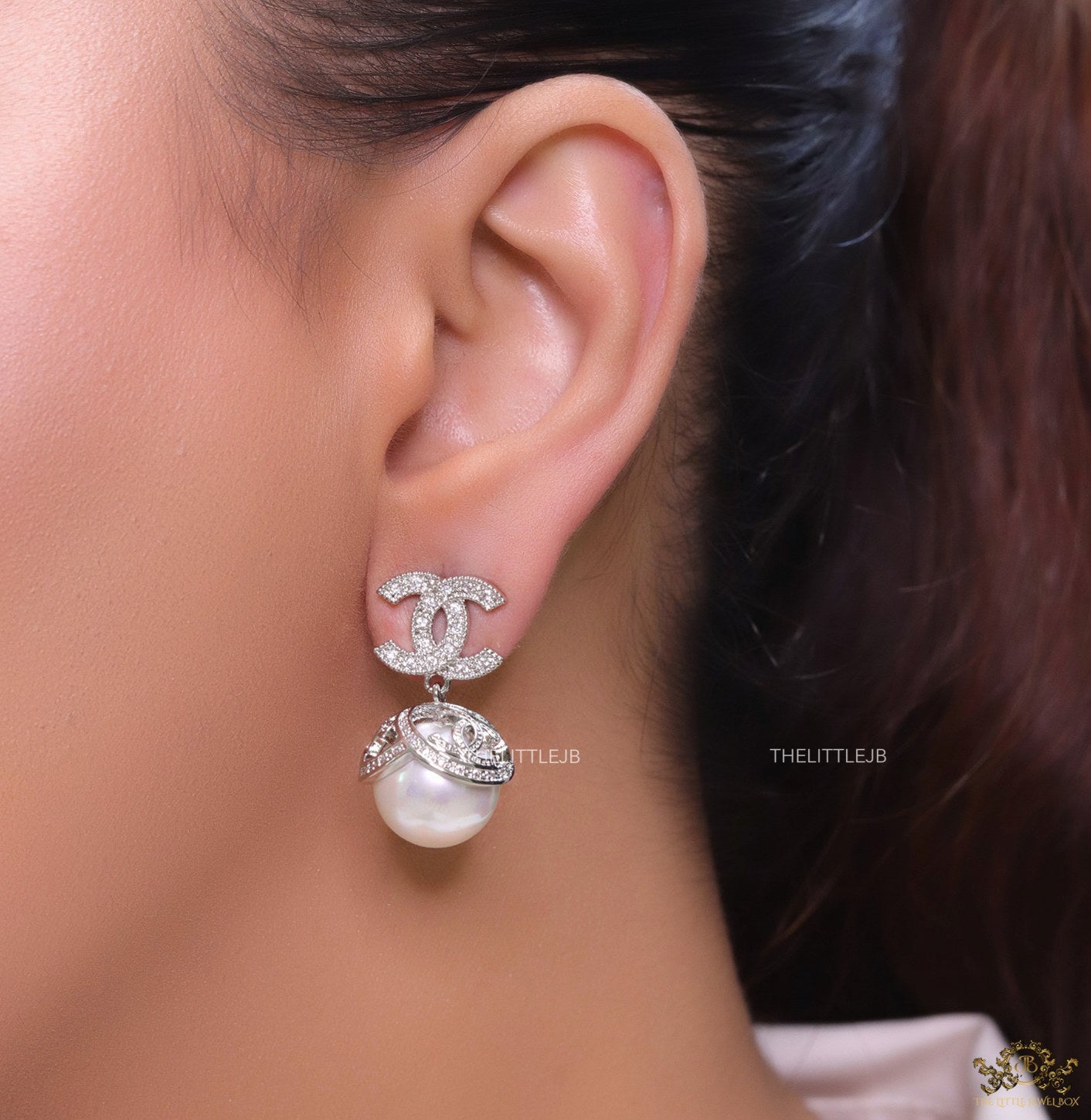 Platinum plated twin C earrings in cz with cz capped pearl drop