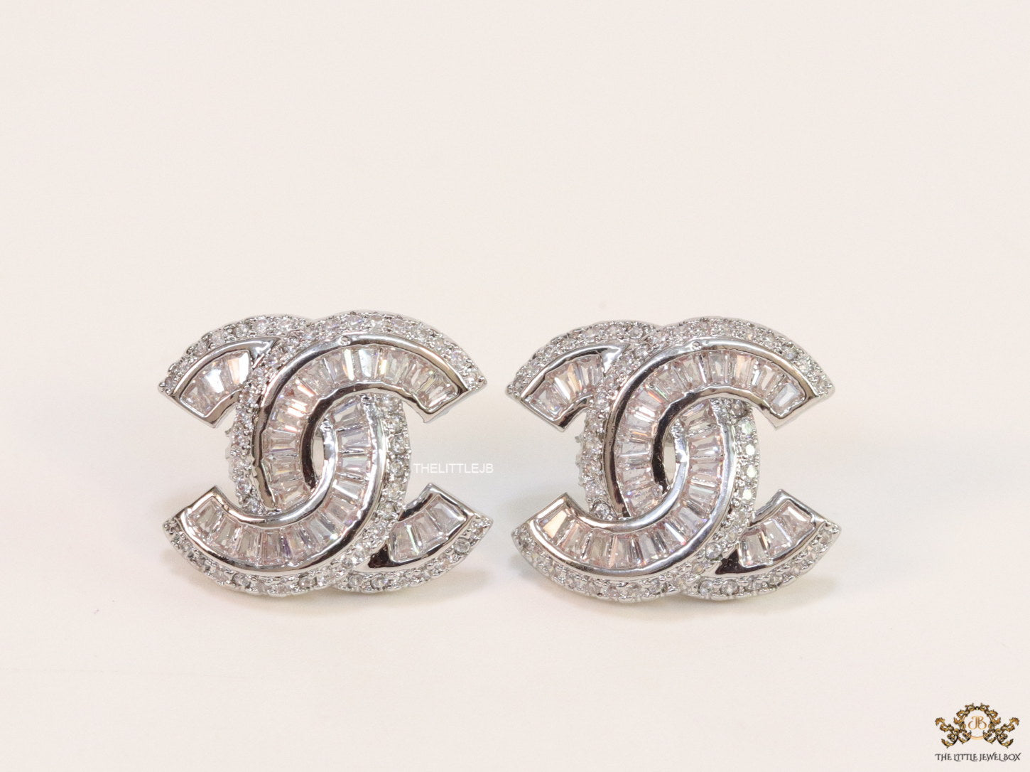 Platinum plated twin C motif cz baguette studs