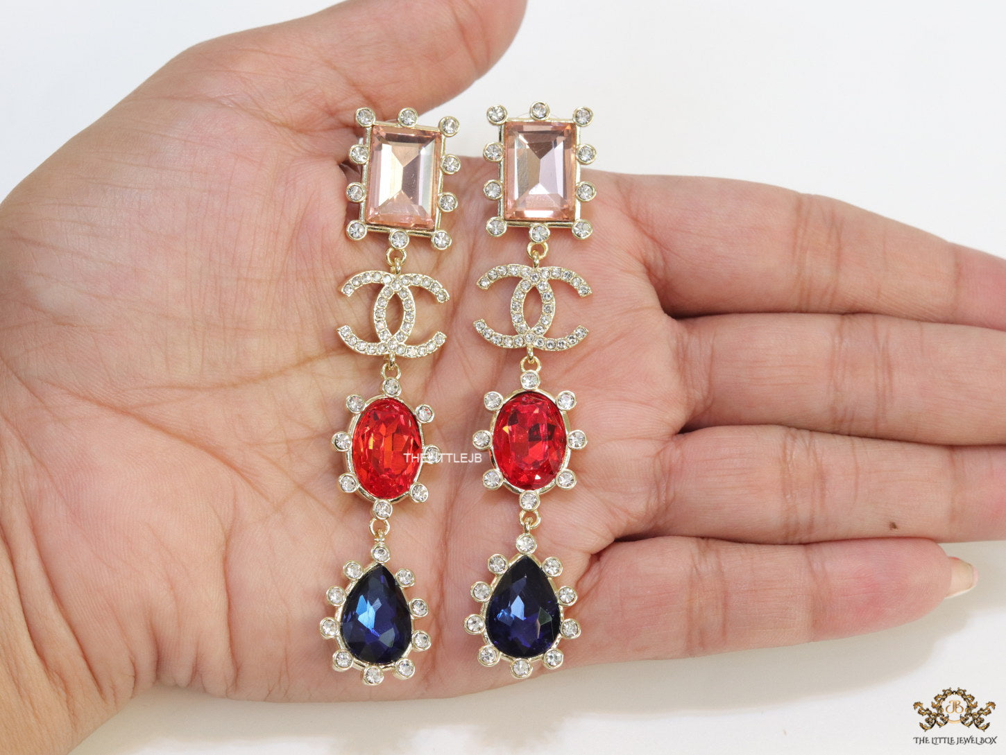 Gold plated cz dangles with red and blue stones and fancy cut cz
