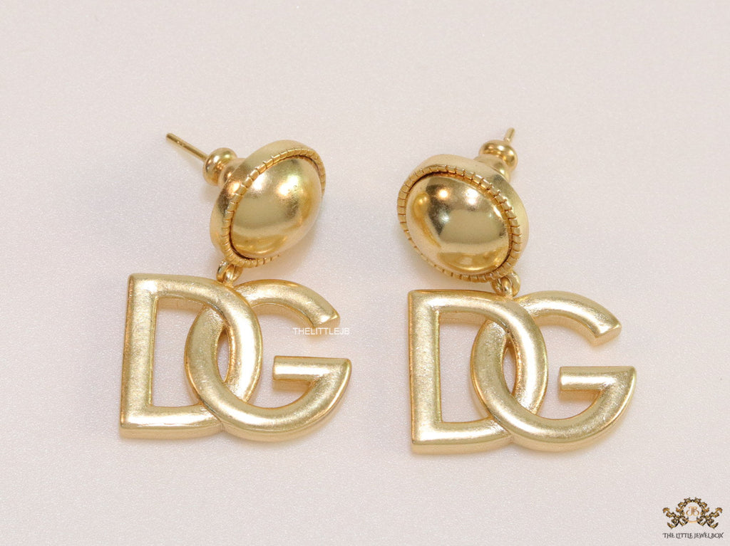 Golden alphabet drop earrings with golden pearl tops