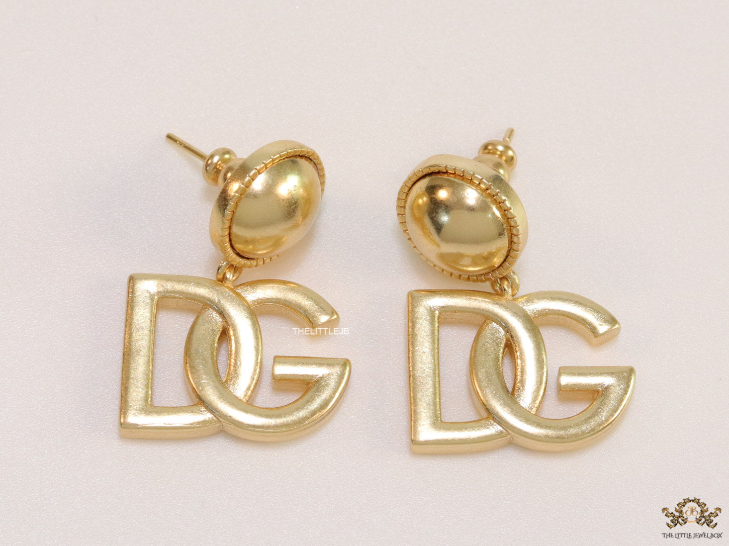 Golden alphabet drop earrings with golden pearl tops