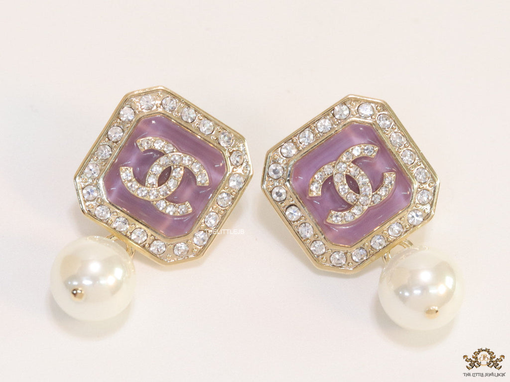 Purple pearl drop earrings with twin C motif in cz
