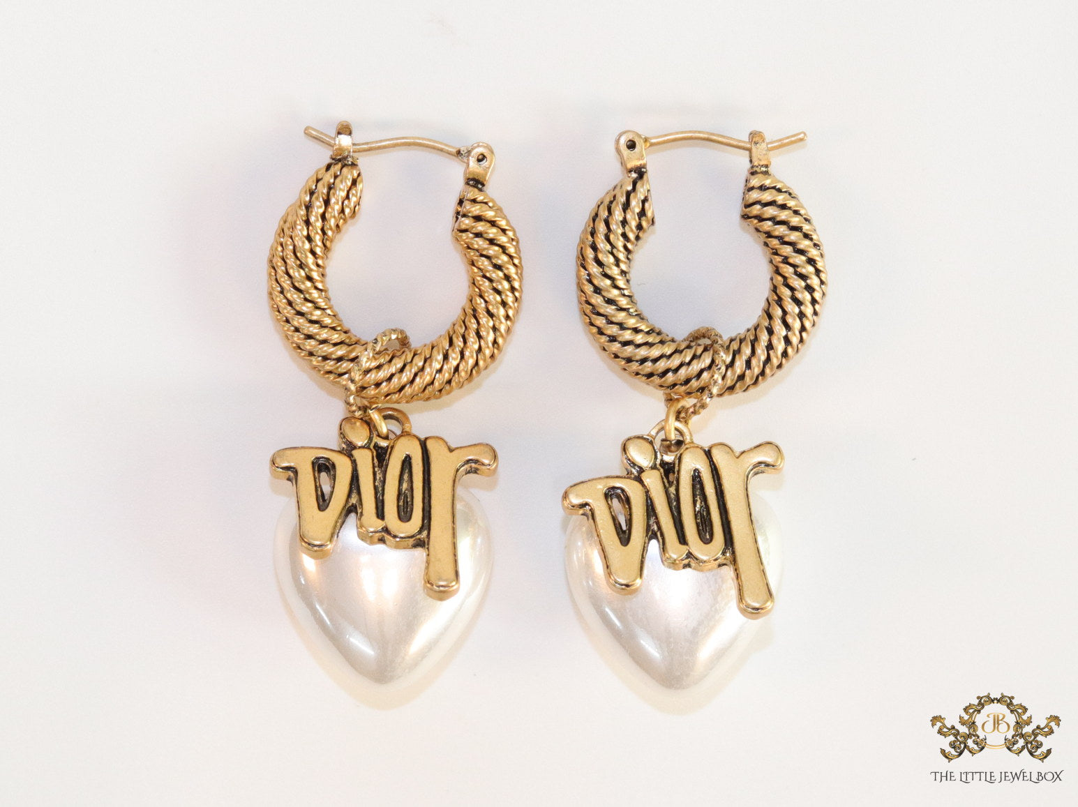 Golden hoops with alphabets and pearl drop