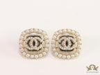 Pearl and cz studs with twin C motif