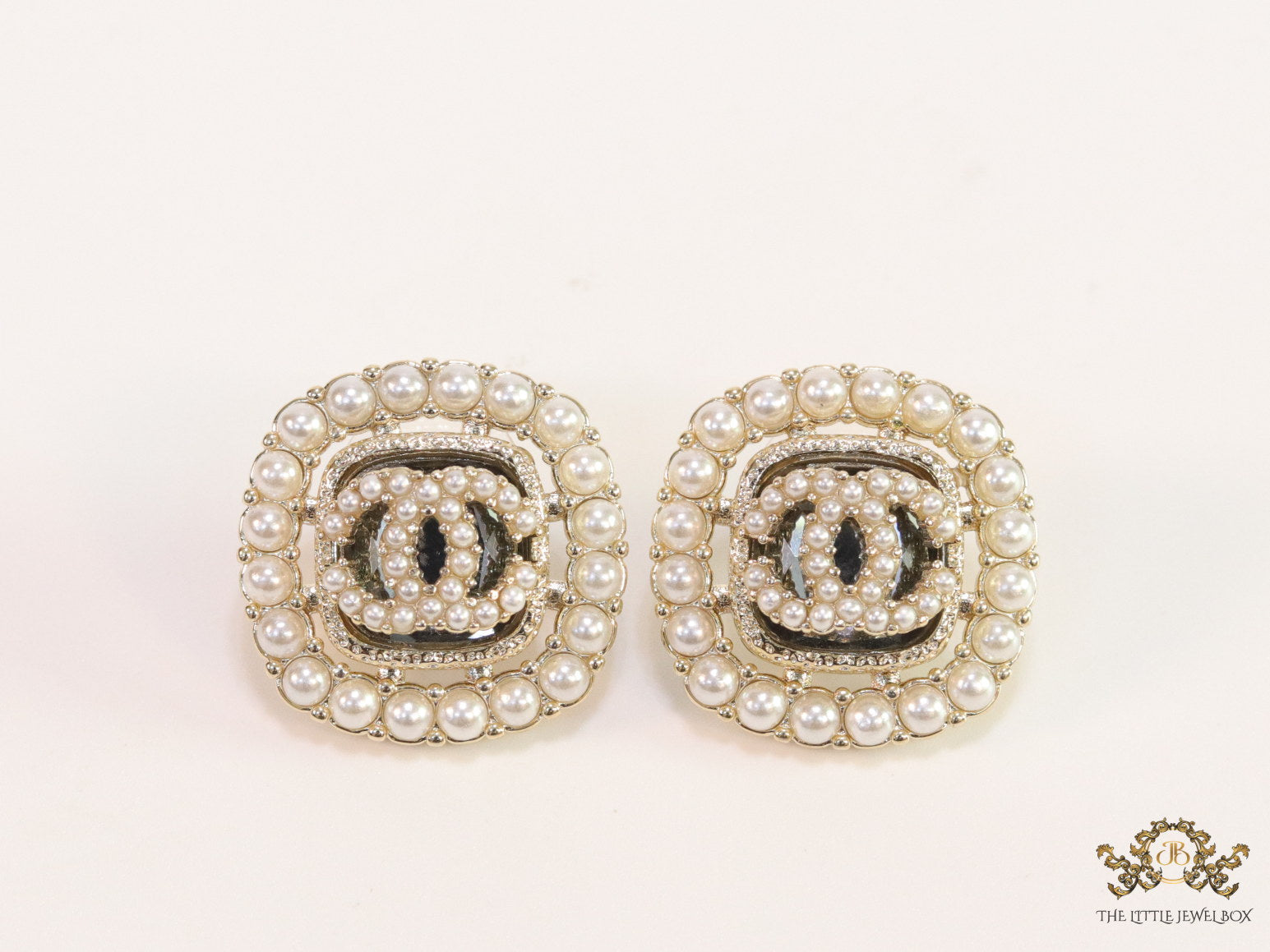 Pearl and cz studs with twin C motif