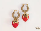 Golden hoops with alphabets and red pearl drop
