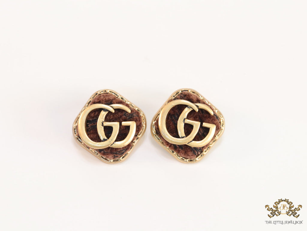 Brown velvet fur studs with golden twin G motif