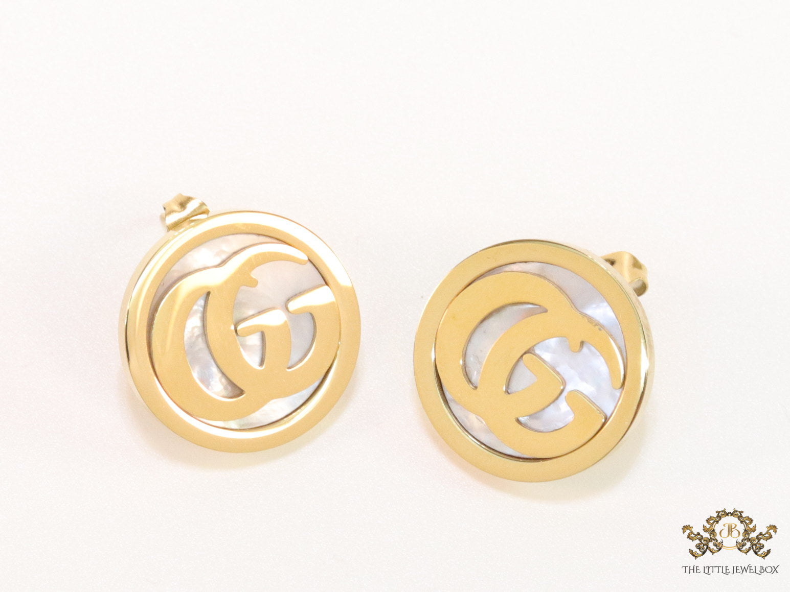 Gold plated twin G motif studs with MOP