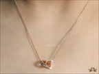 Rose gold plated D initial necklace with interlocking cz ring