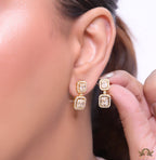 Gold plated cz dangle earrings with cz baguettes