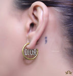 Open golden hoops with cz alphabets