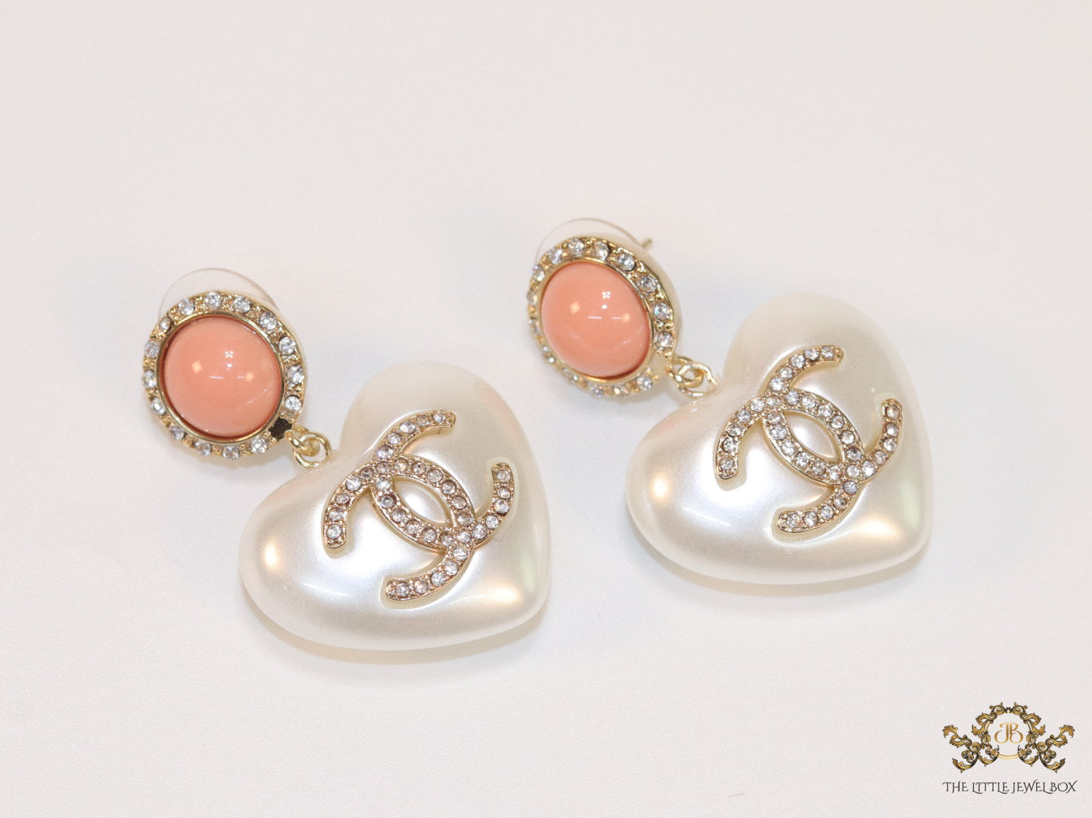 Heart shaped pearl and cz earrings with twin C motif