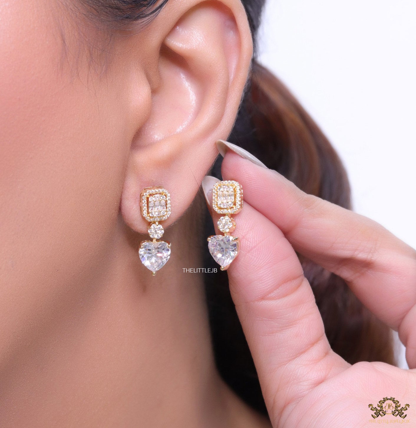 Golden cz baguette earrings with heart shape cz drop