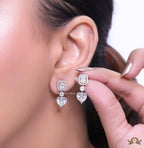 Cz baguette earrings in platinum with heart shape cz drop