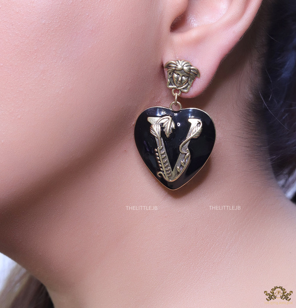 Gold plated medusa earrings with V motif black heart shape drop