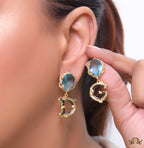 Semi-precious blue stone with gold plated detailed with black and golden alphabet drop
