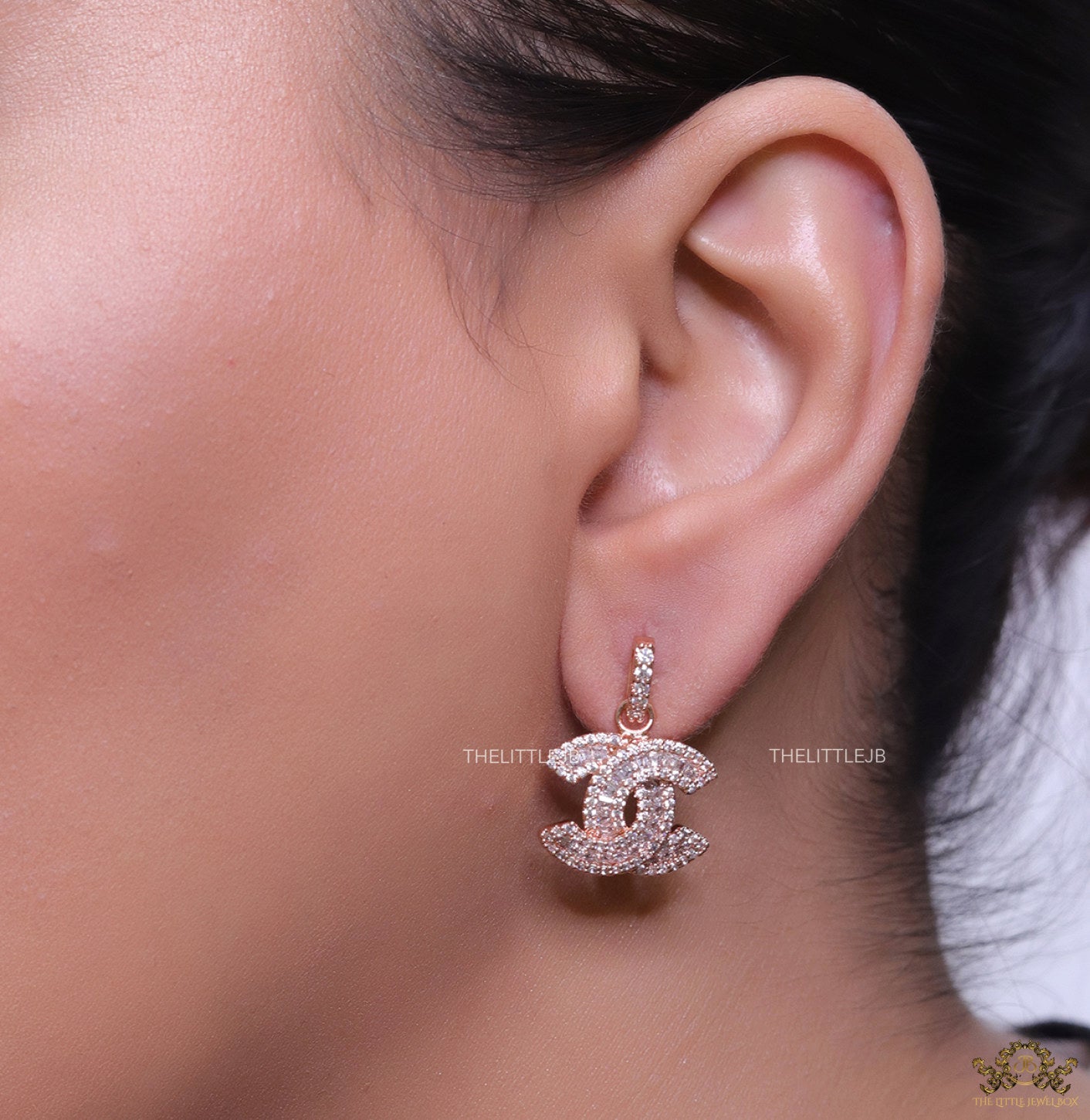 Rose gold plated cz dangle earrings with twin C motif