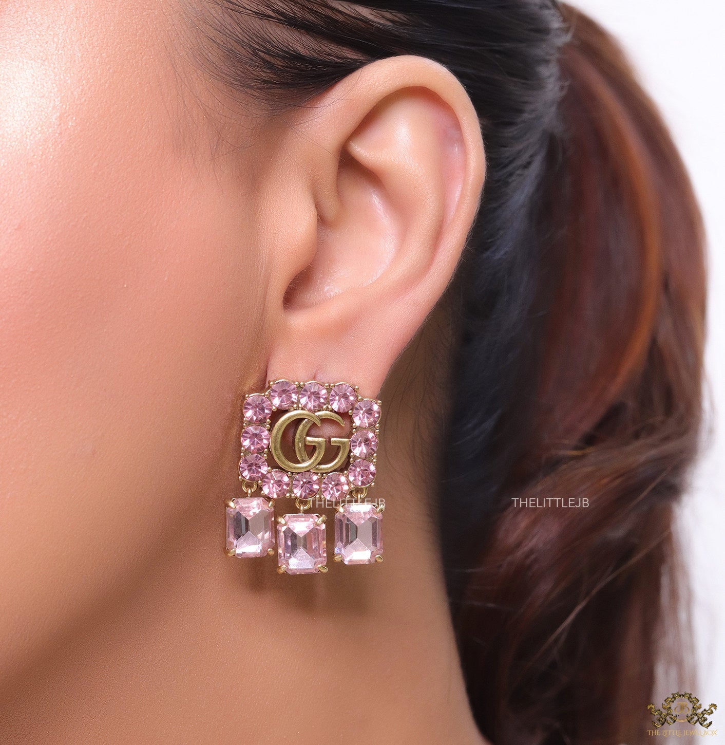 Lavender stone studes with gold plaetd double G motif and lavender stone drop