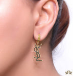 Tiny alphabet earrings in golden and black finish
